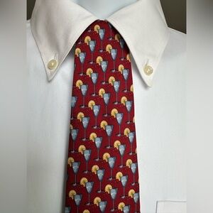 Barneys New York Red Tie with Blue and Gold Cocktail Design. 100% silk